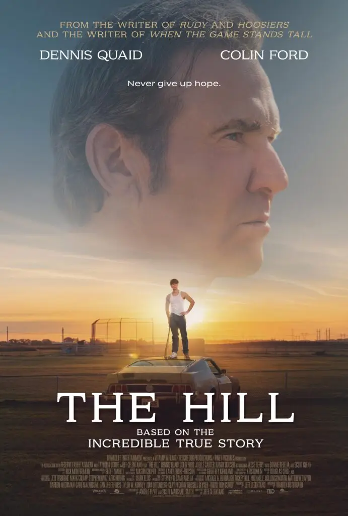 Official poster for The Hill (2023) featuring a young man standing on a car at sunrise with Dennis Quaid’s face in the sky above, symbolizing faith, perseverance, and hope.